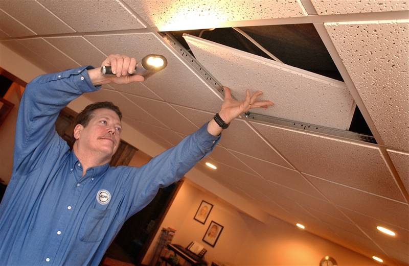 Lifting Ceiling Tile at an Inspection